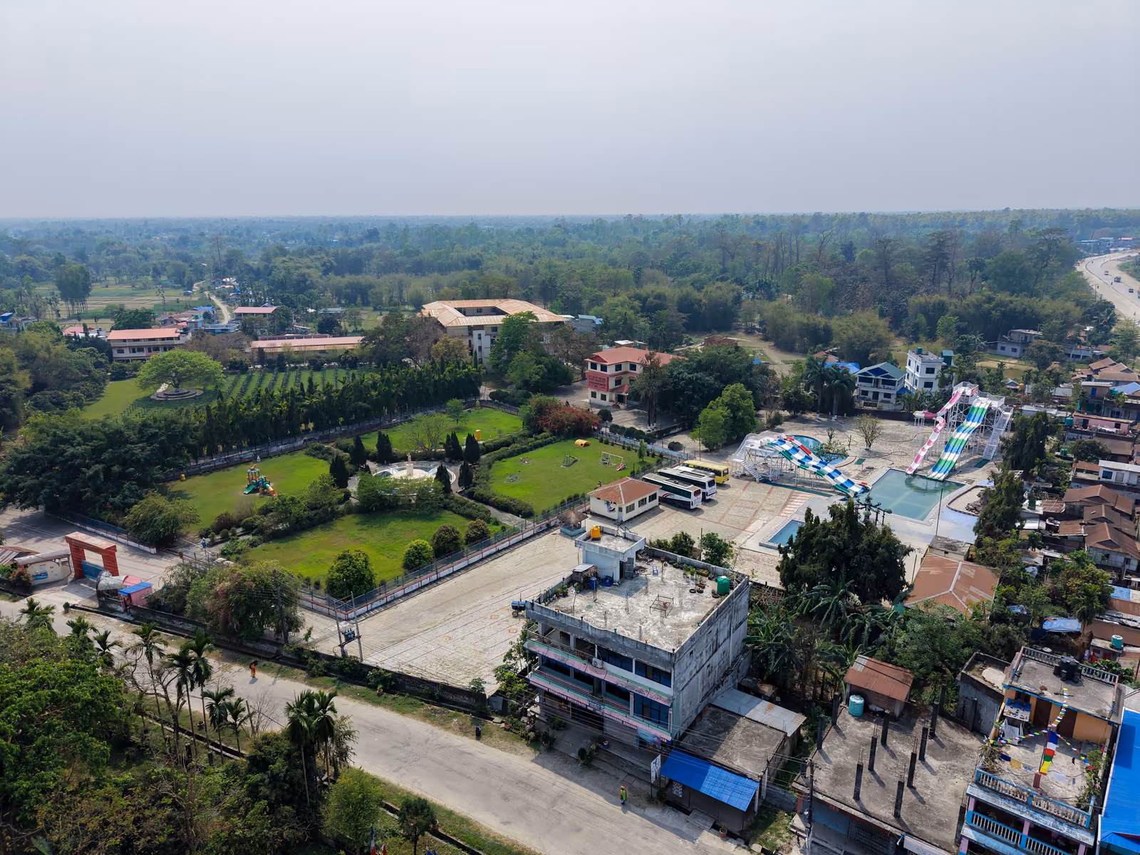The academy campus from the air, its blocks and playing fields along the highway
