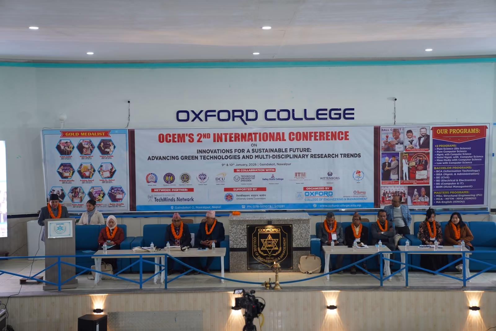 A full auditorium at the college's second international conference, the stage party seated at the front