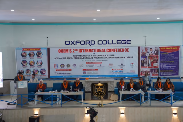 A full auditorium at the college's second international conference, the stage party seated at the front